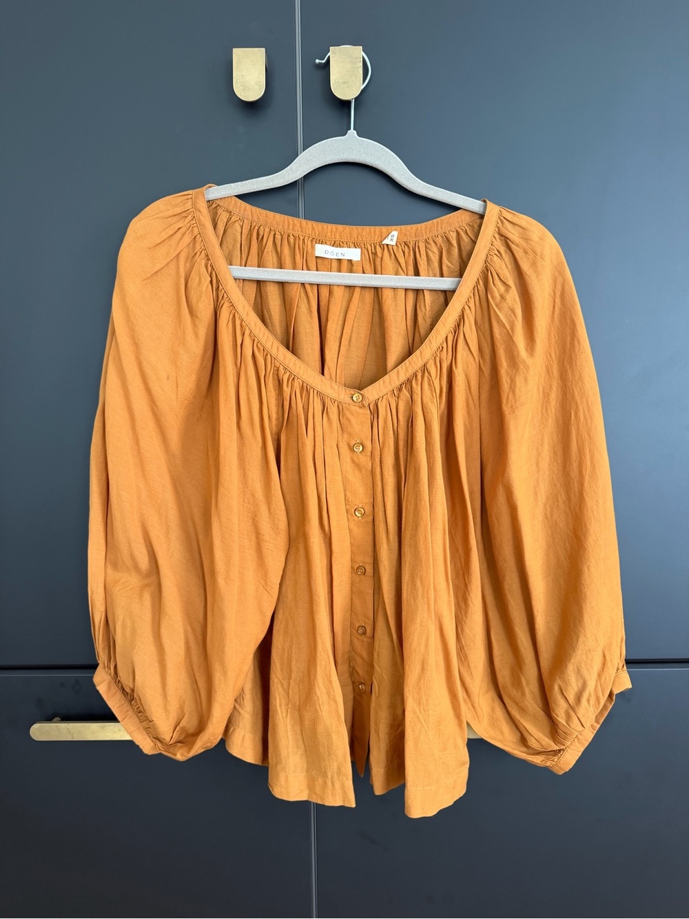 Does orange/sienna Button-Front Peasant Blouse